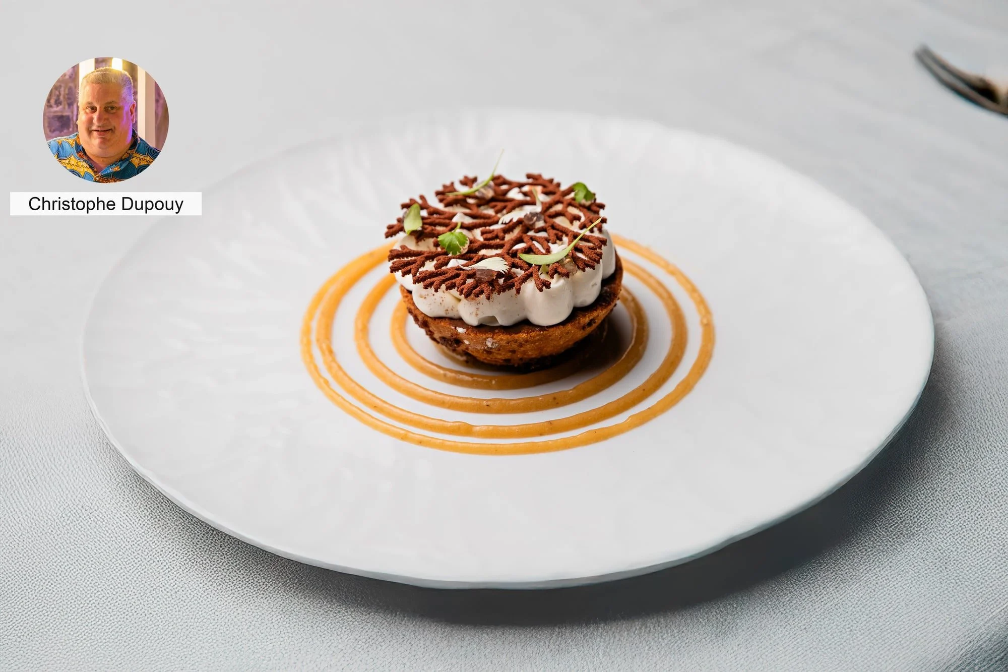 Gourmet tart with cream by chef Christophe Dupouy.
