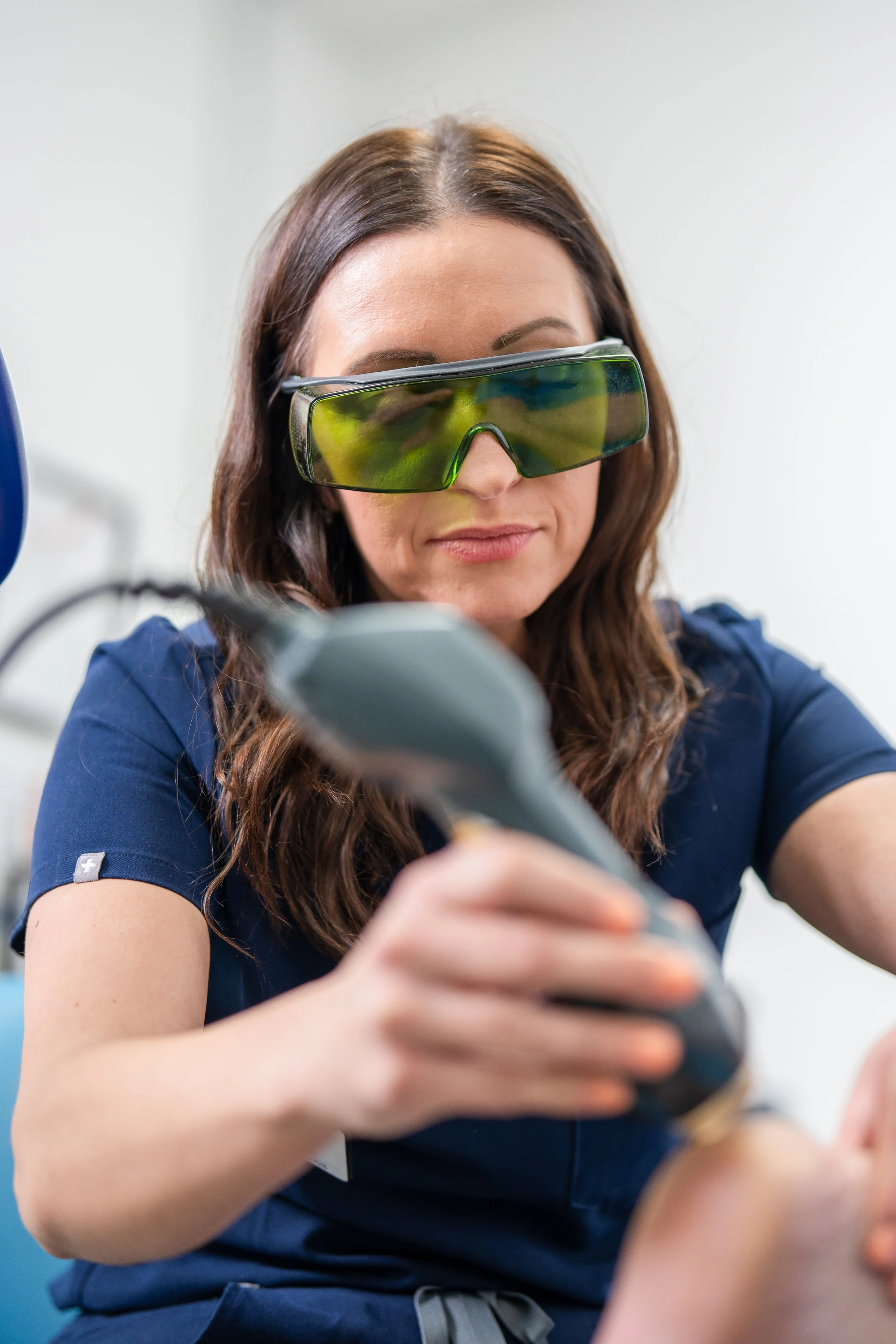 Lead podiatrist providing MLS laser therapy for foot pain at Next Step Podiatry, Kettering.