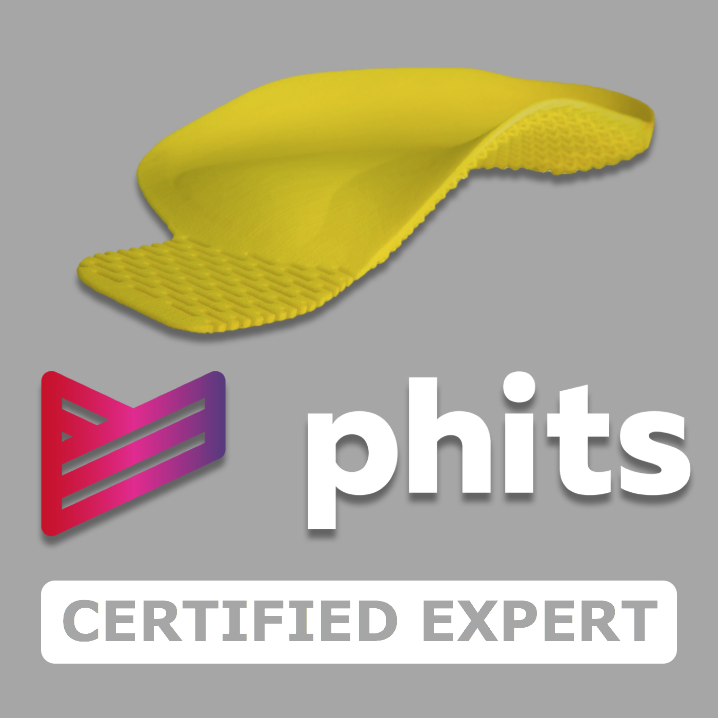 A yellow silicone scraper with a textured edge, placed on a gray background with the logo 'phits' and words 'CERTIFIED EXPERT' below.
