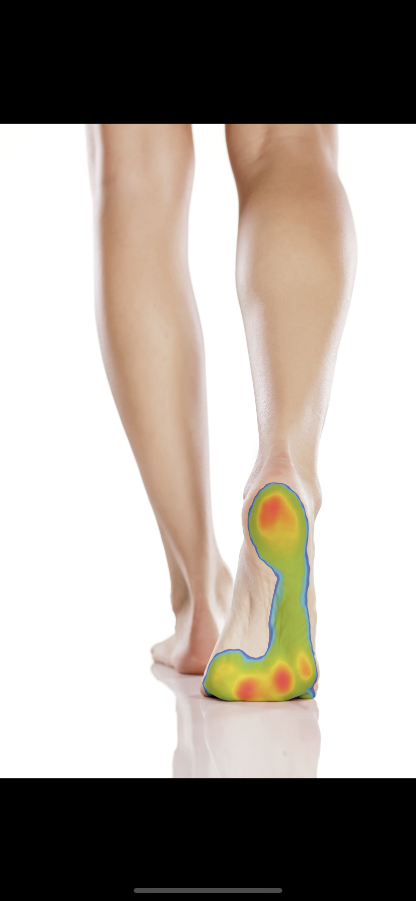 A person standing with one foot slightly raised, showing the bottom of their foot with a heat map overlay indicating pressure points and areas of contact.