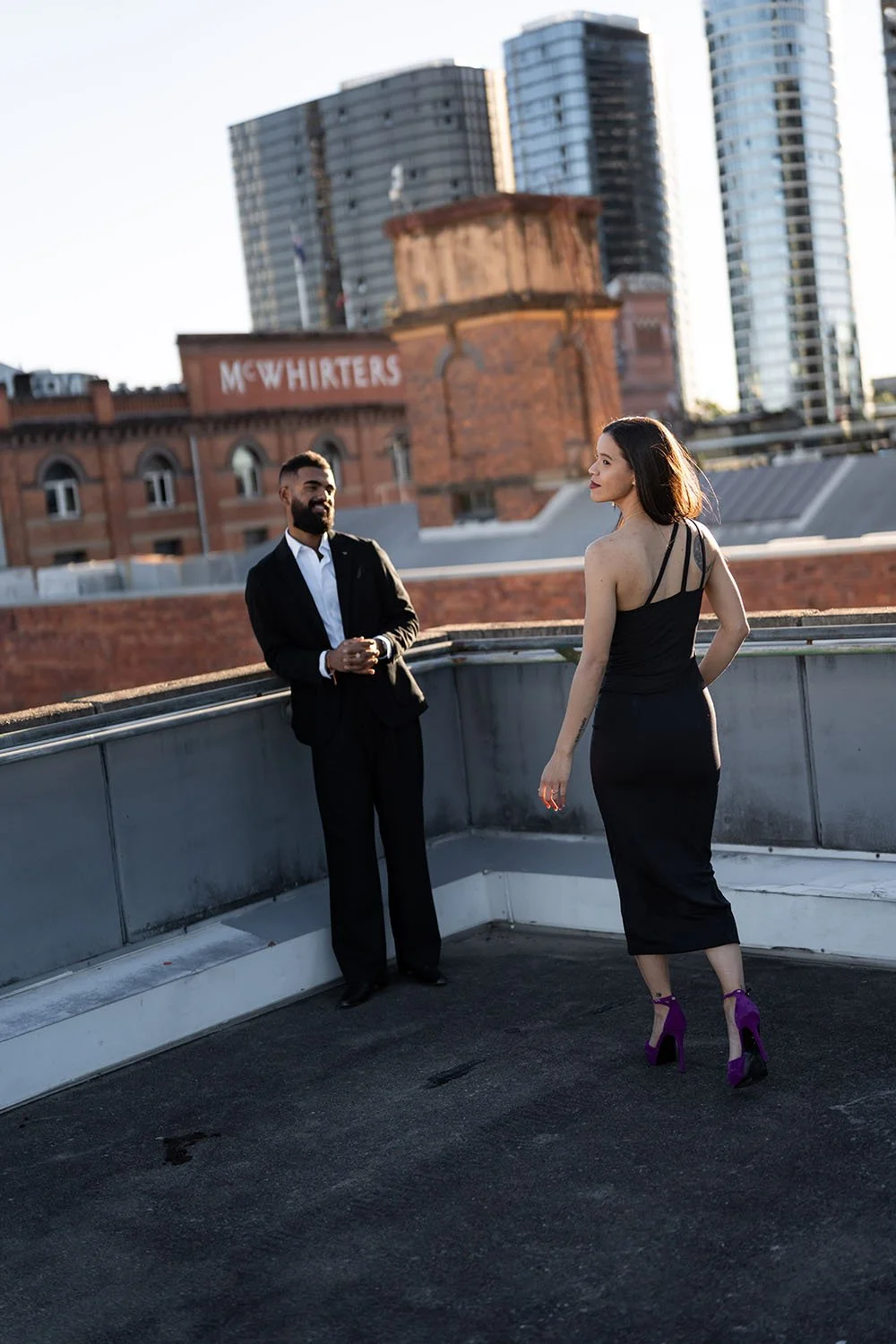 Jasmin walking towards to Jay with look back to the Brisbane wedding photographer Whistler