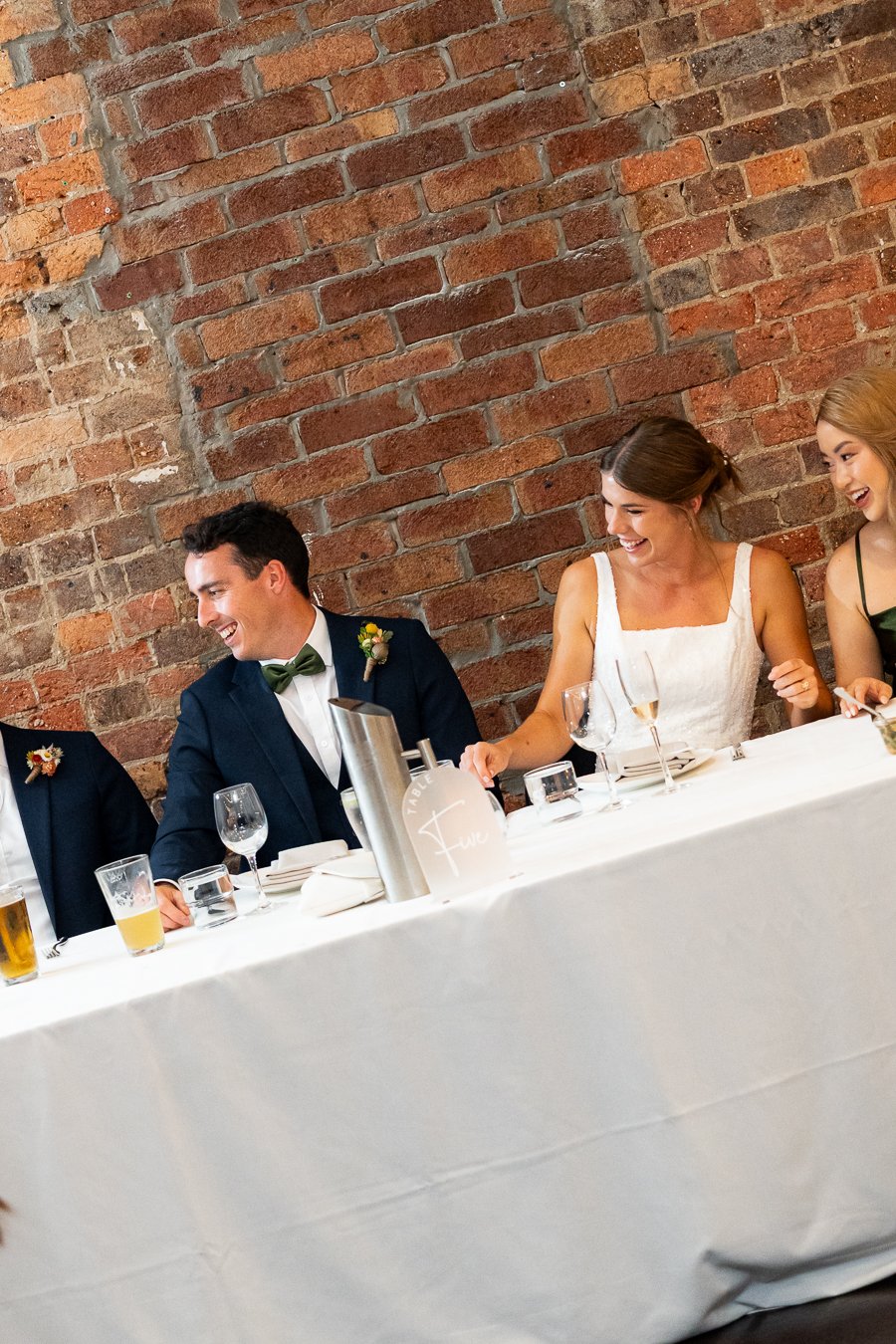 Sonya and Giordan laughing to the best man