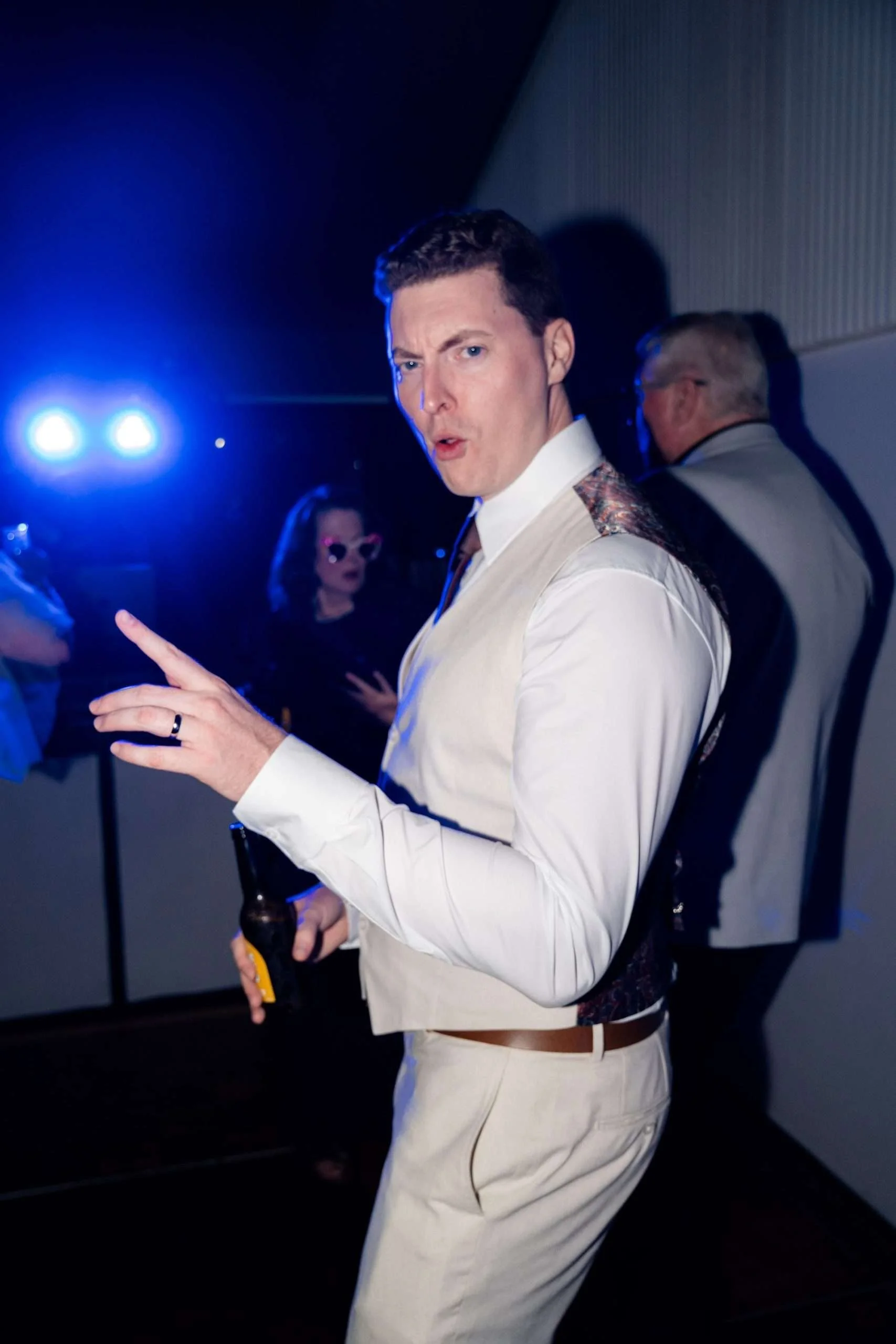 groom who to the camera in dance floor