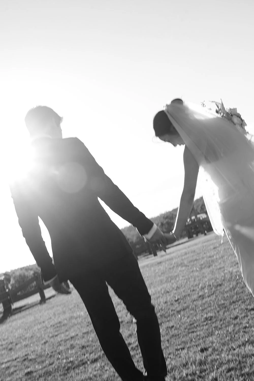 lights through Eric's shoulder while they holding hands together