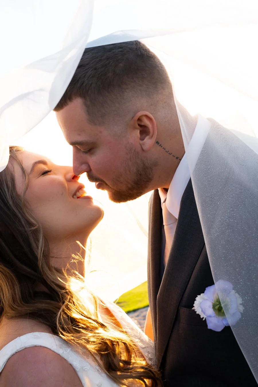 Ben and Chiarra try to kiss with eyes close under veil