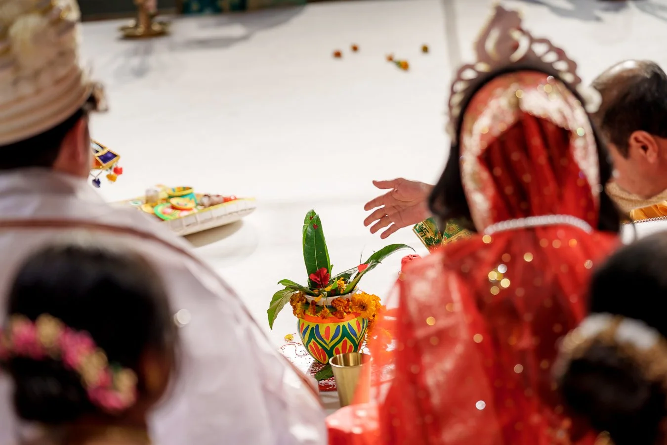 Amrita's uncle throw wishes into a pot that holds good fortune