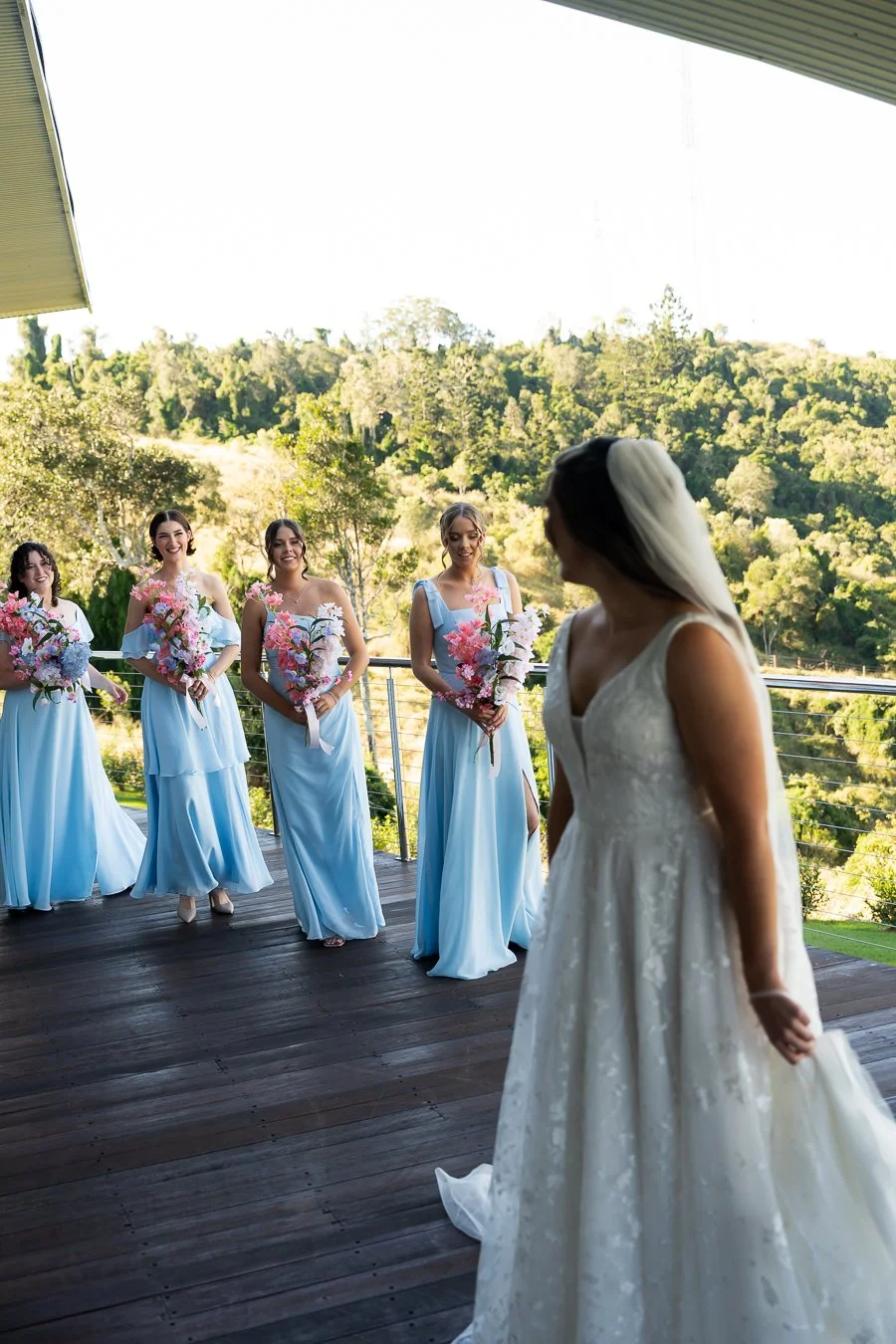 bride Chiarra look back to her brides mates 