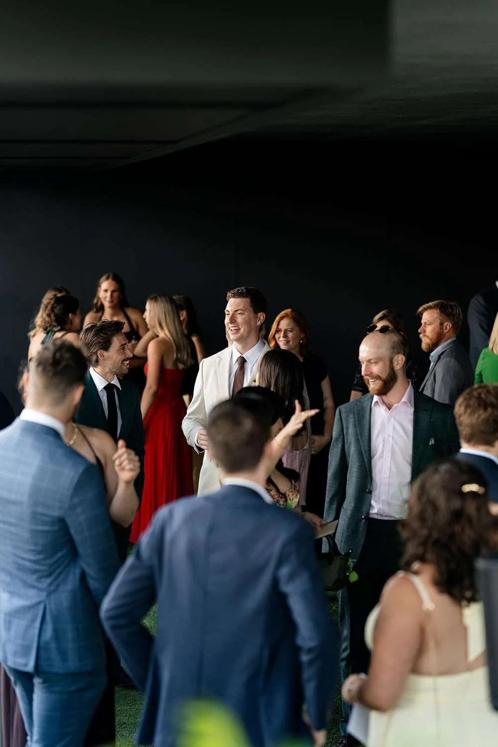 groom Jack talking to his guests before wedding ceremony