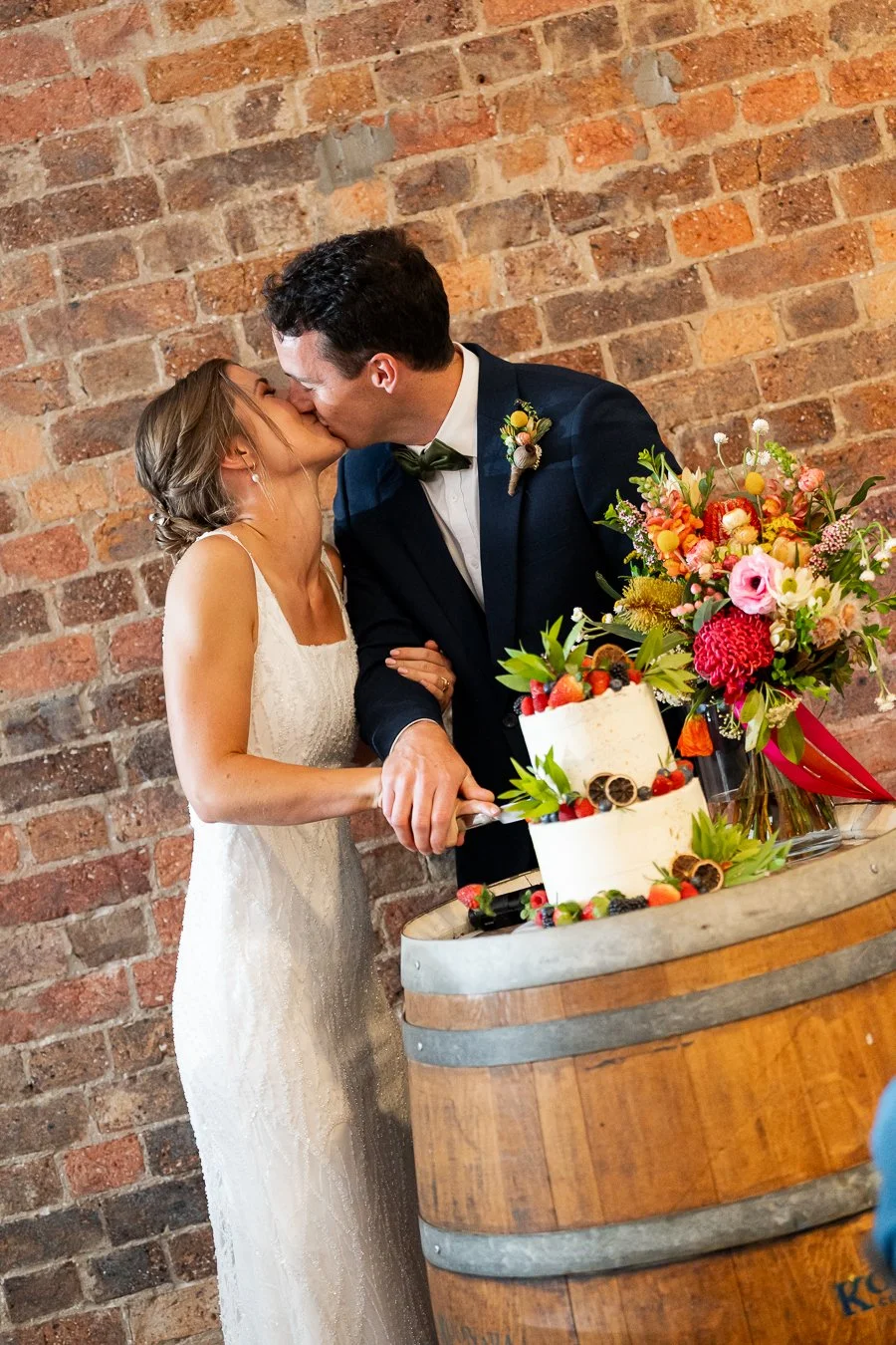 bride and groom cutting the cake
