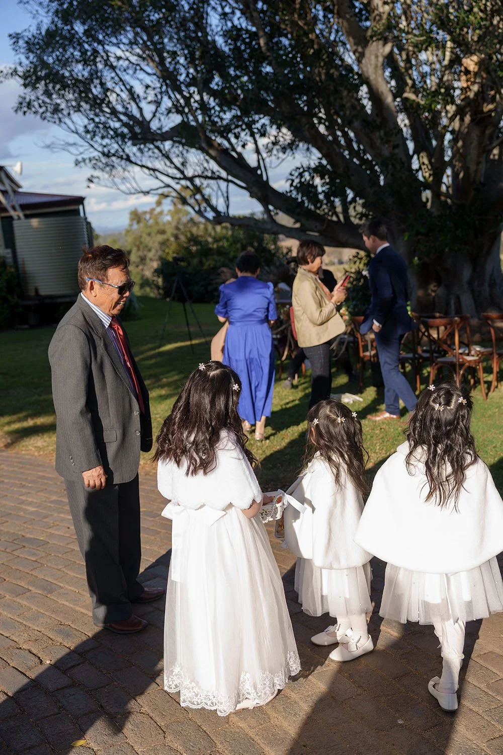 Eric's father talking to his three grand daughters