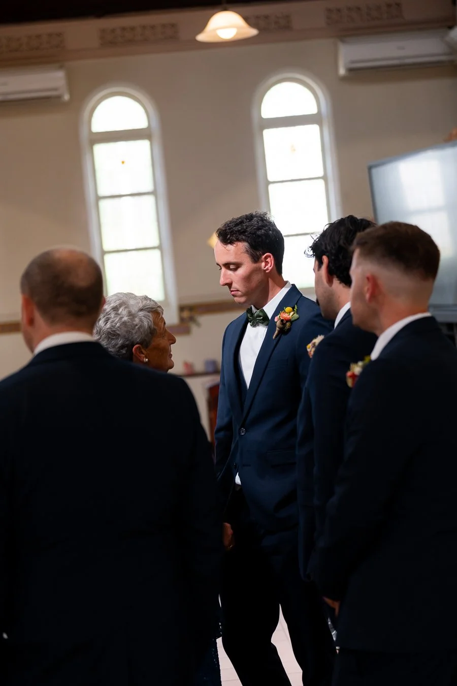 The groom’s grandmother spoke to him before the ceremony.