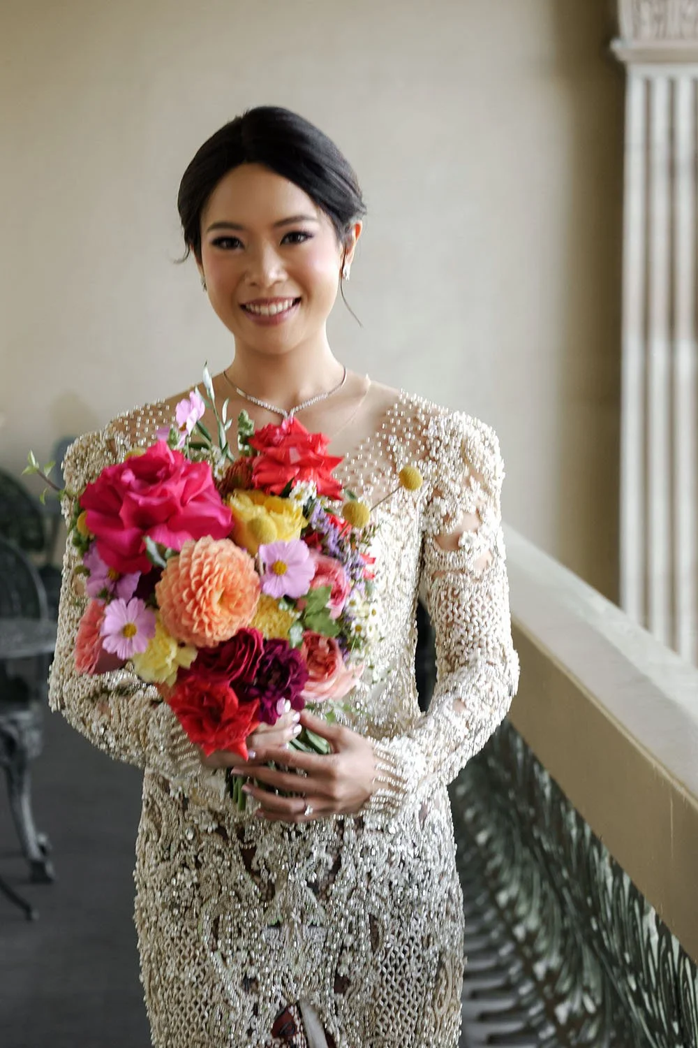 bride Nori holding her flower while look forwards
