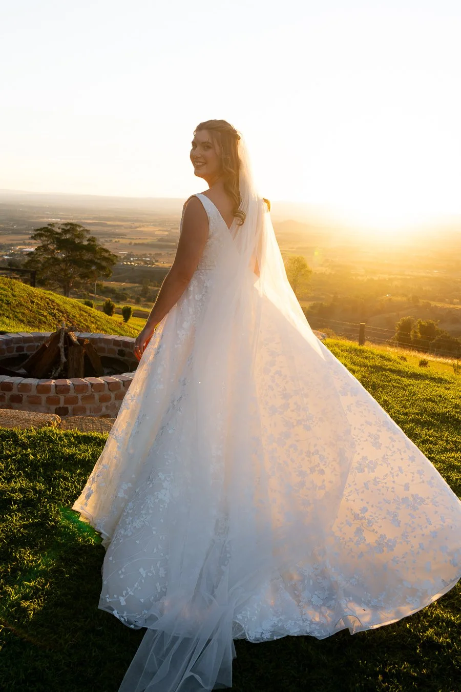 bride Chiarra turning through her left look back to the Brisbane wedding photographer Whistler Li