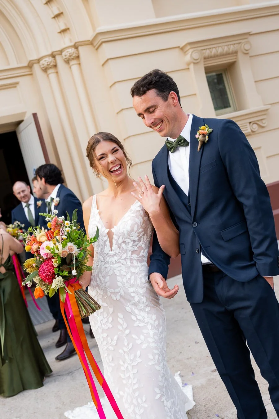 bride Sonya showing her wedding ring to the Brisbane wedding photographer Whistler Li with excitement