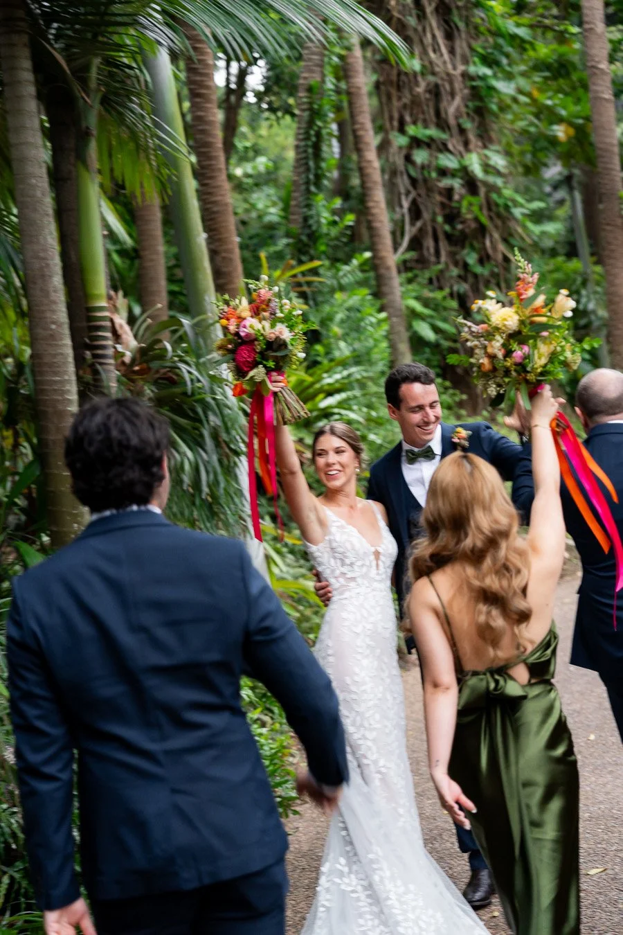 bride Sonya raising her flower excitement to bridal party
