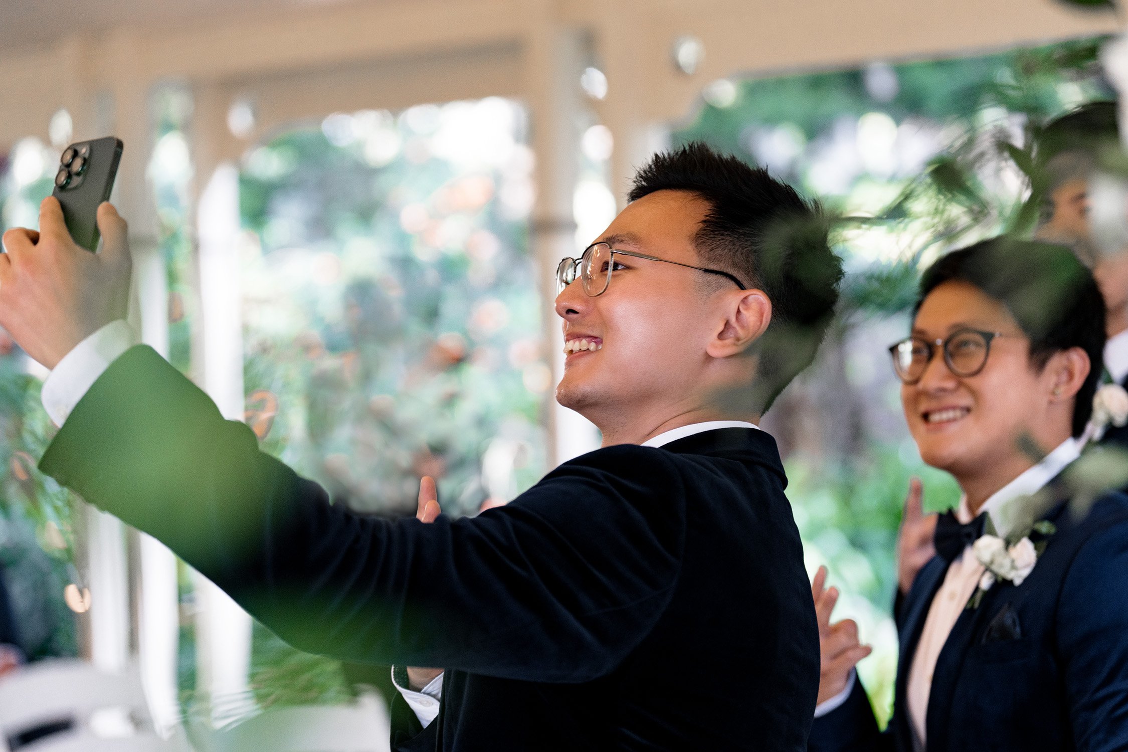 groom Brus taking a self with his groomsmen before the wedding ceremony