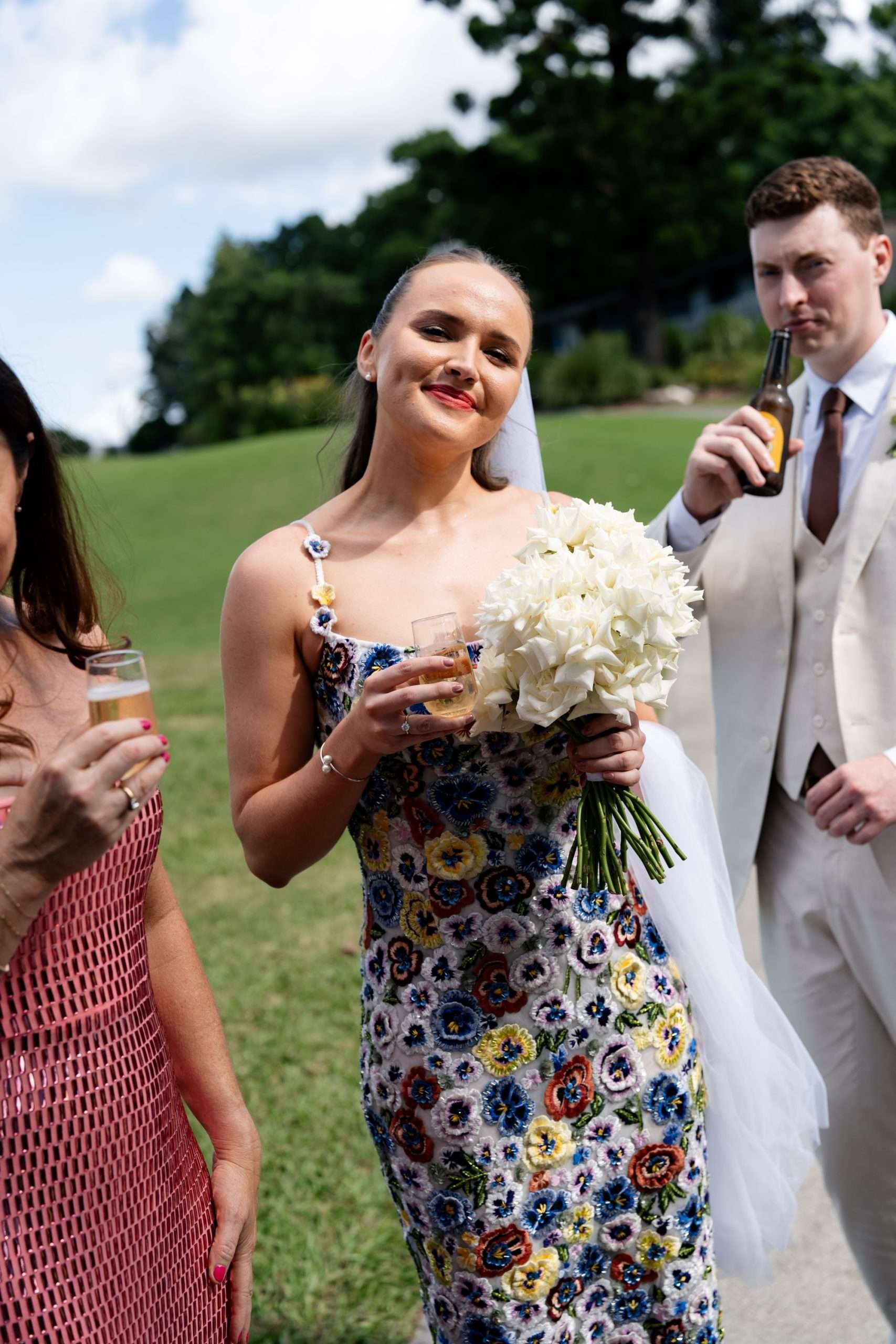 Bride tilting her head and looking at the camera with a smile.