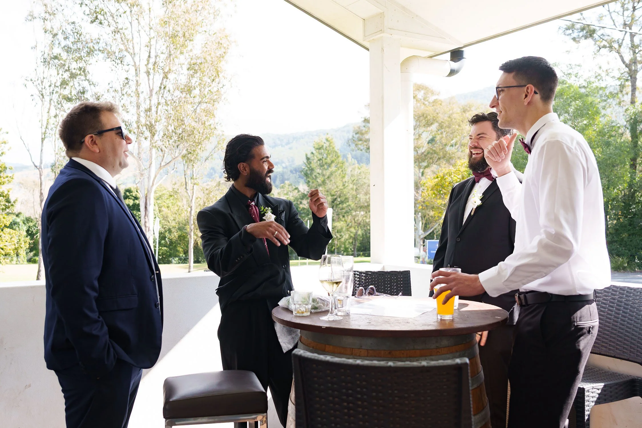 Jay gesture hands up and down talking to his groomsmen