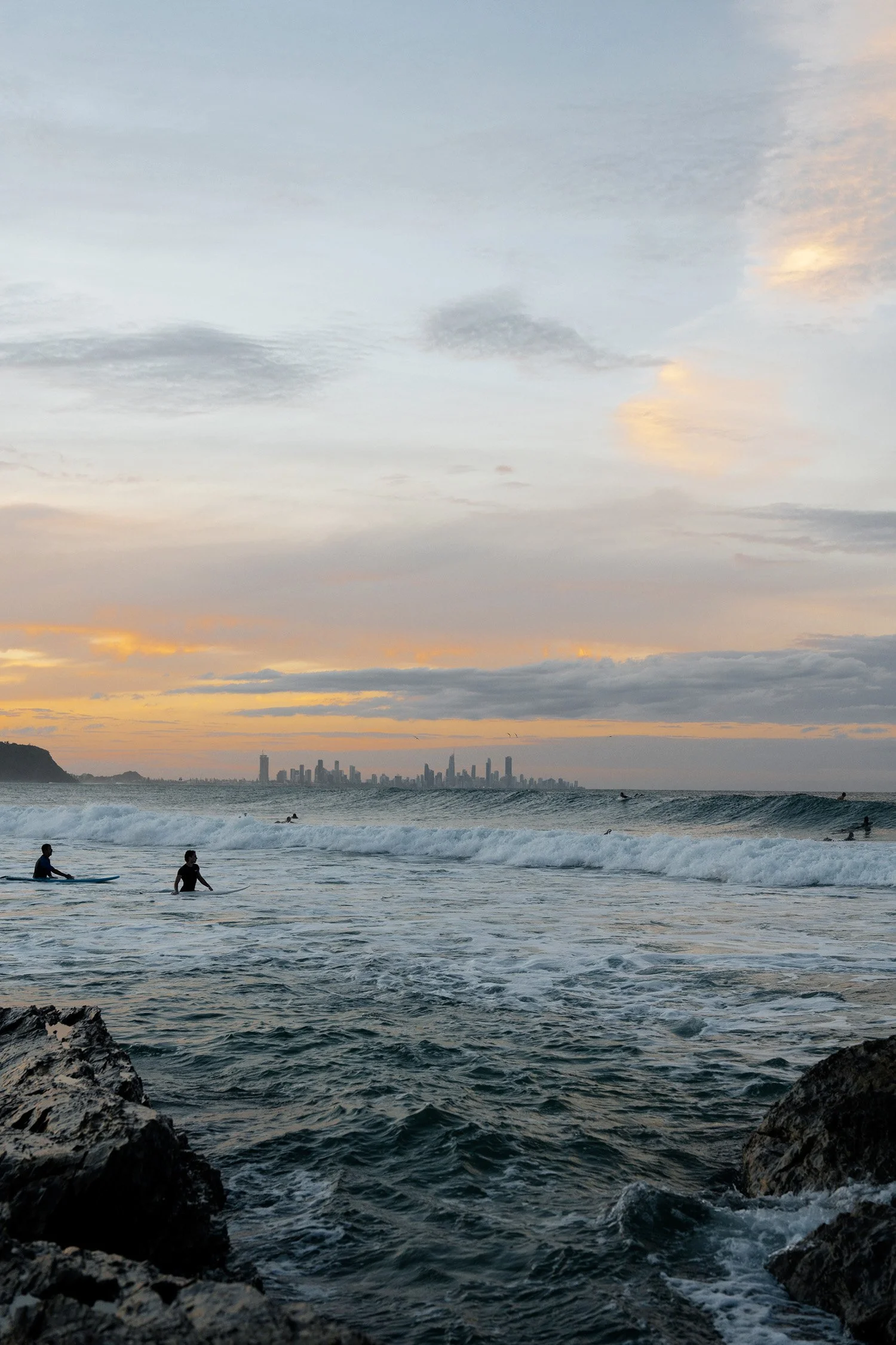 Gold Coast city view under a sunset in Currumbin Rock