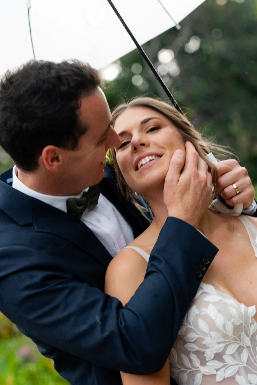 groom Giordan hand touching bride Sonya's face when holding her from behind