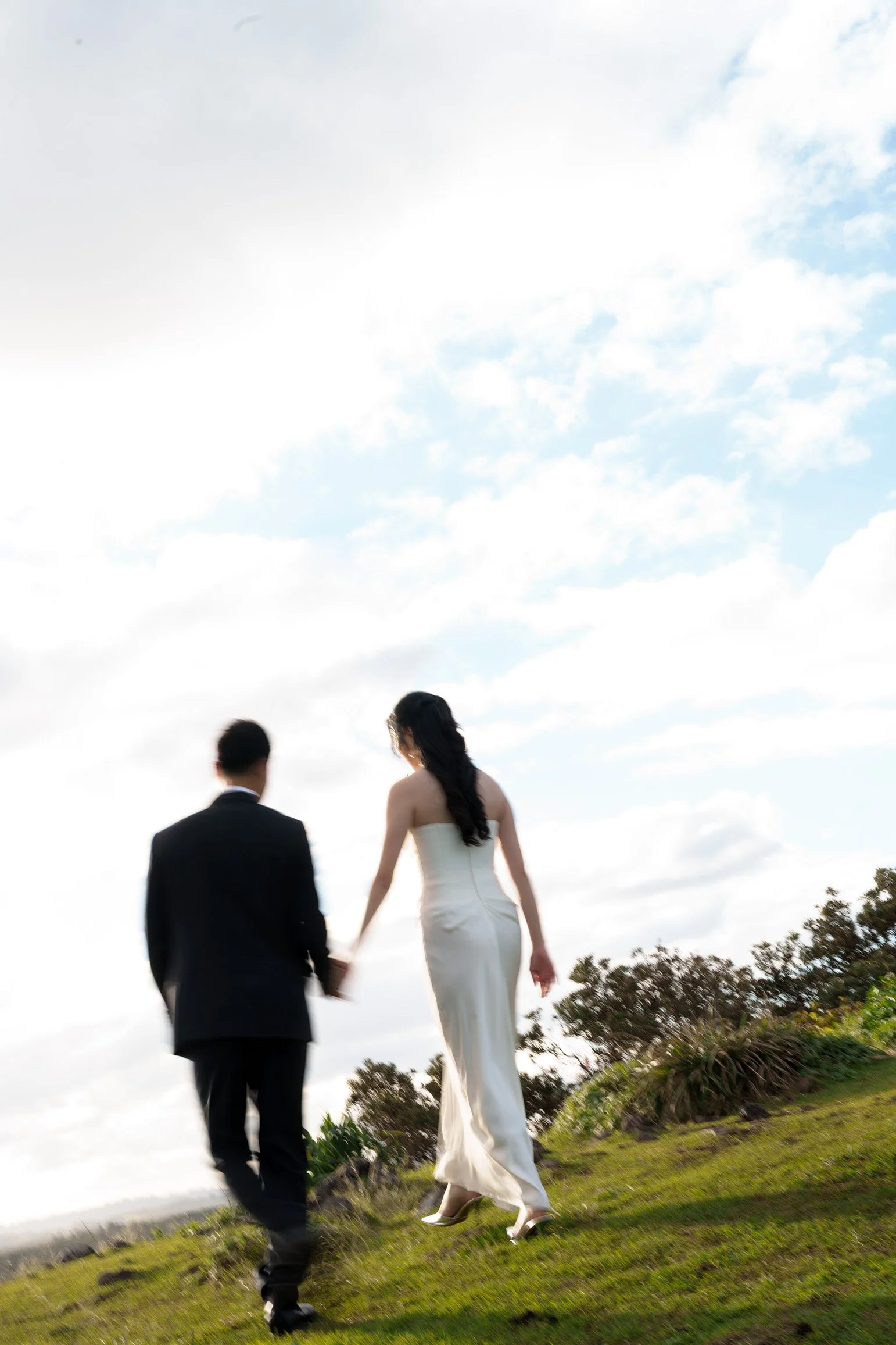 Margaret and Silva hands holding walking towards to the sun