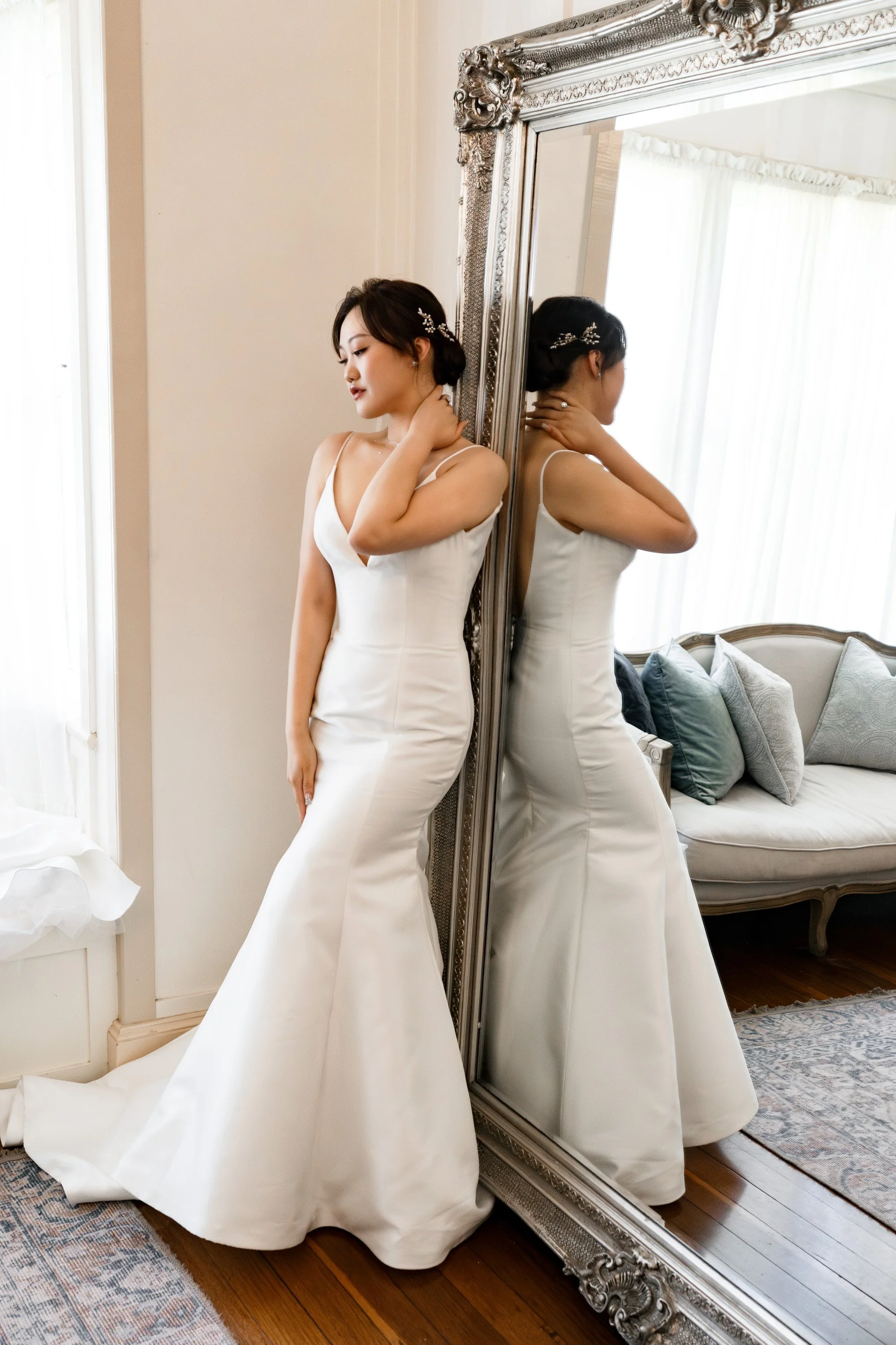 bride Vicky holding her nick and look down to the floor