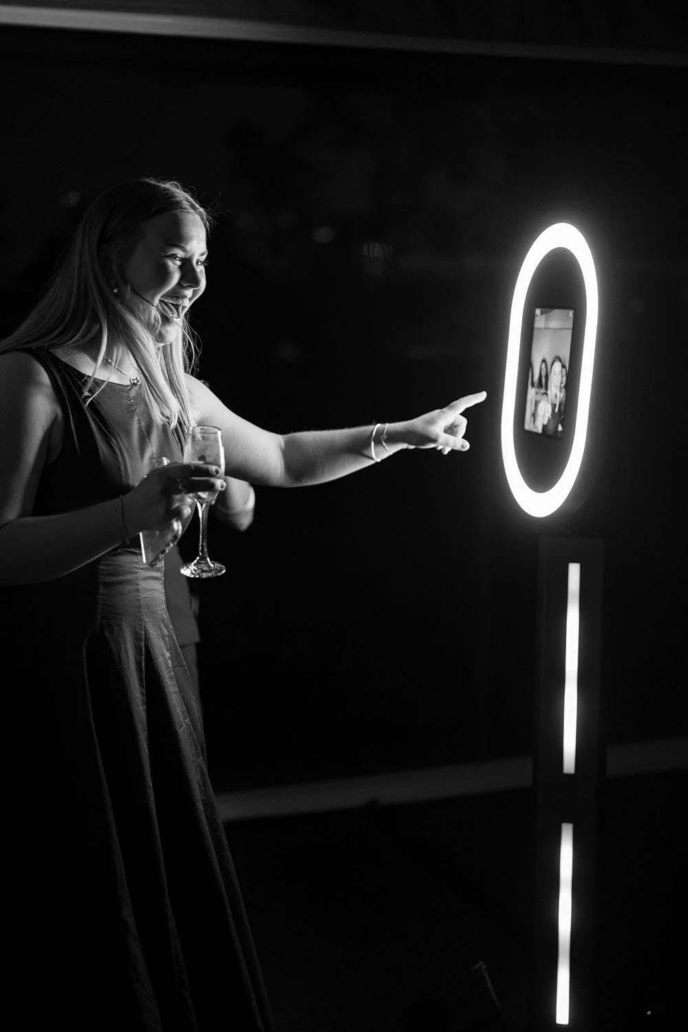 A guest looked at the photo booth screen with surprise and joy