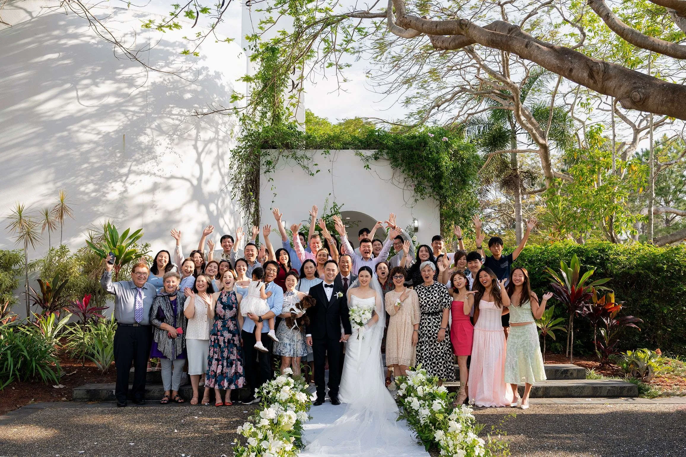 group photos, everyone raising up their hands to the camera