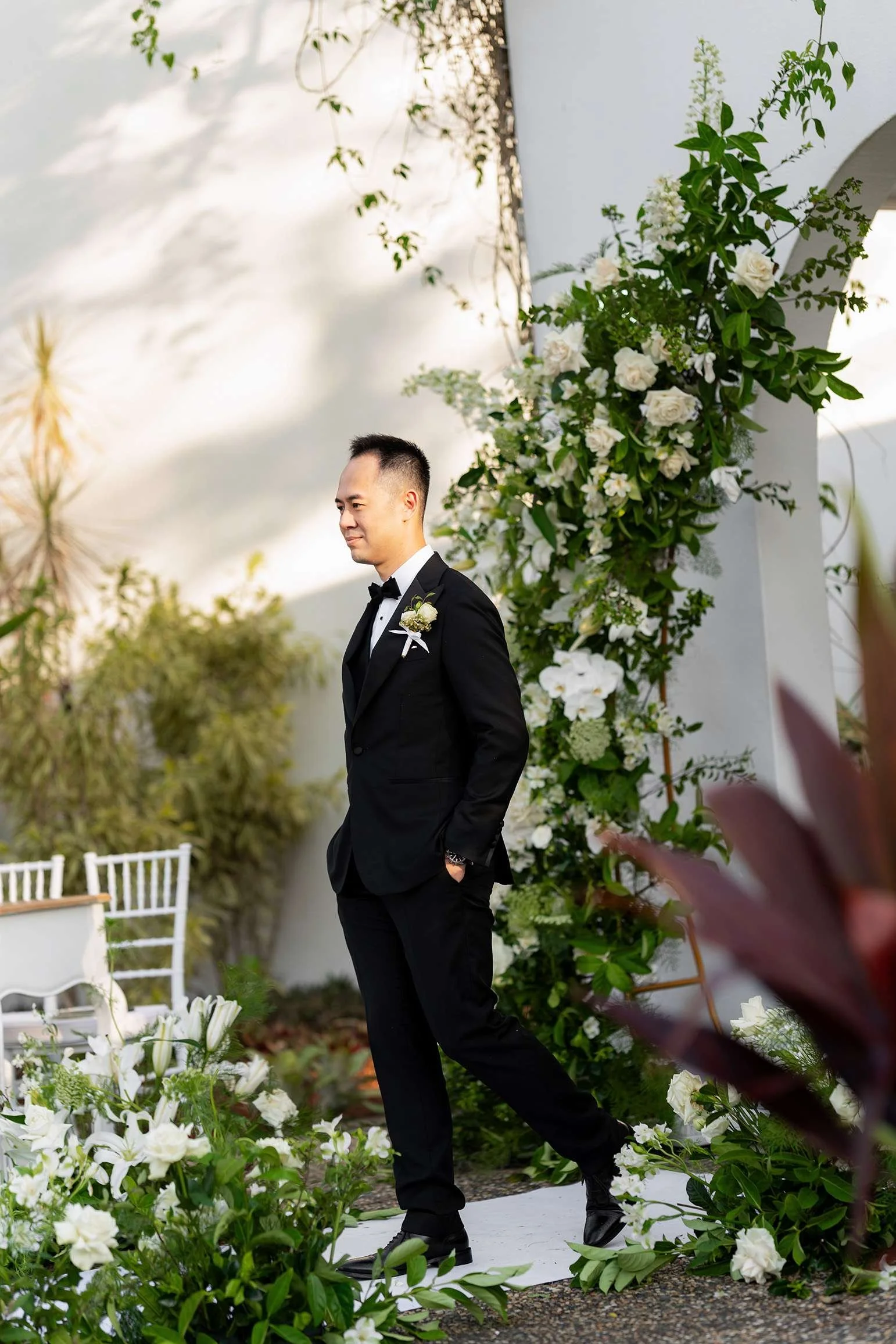 groom Alex walking with two hands inside pocket