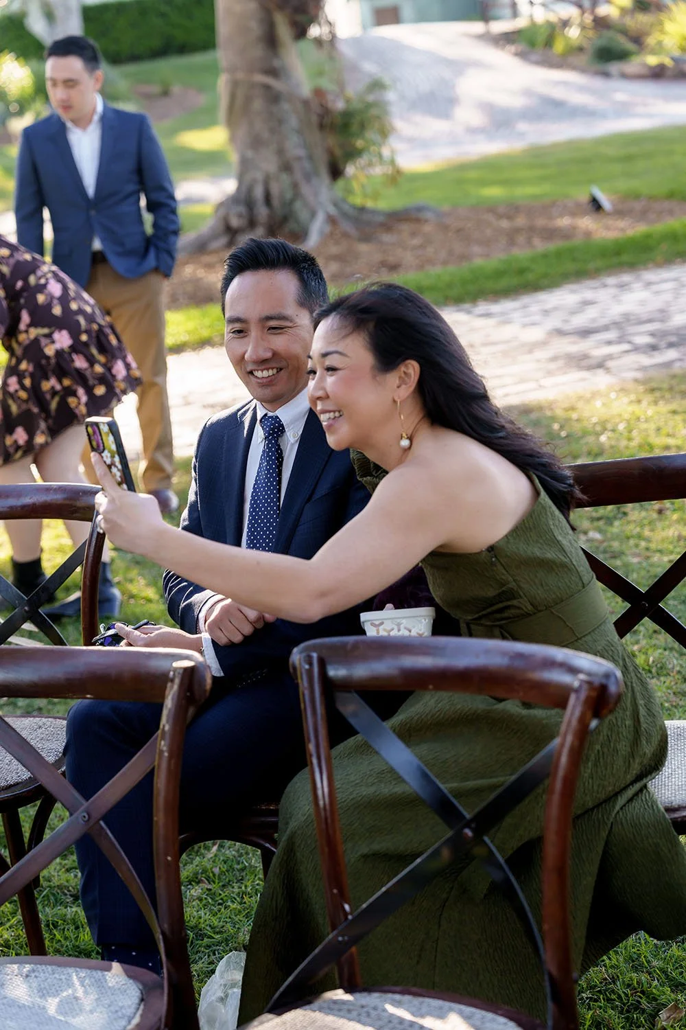 Eric's sister with her husband taking selfie 