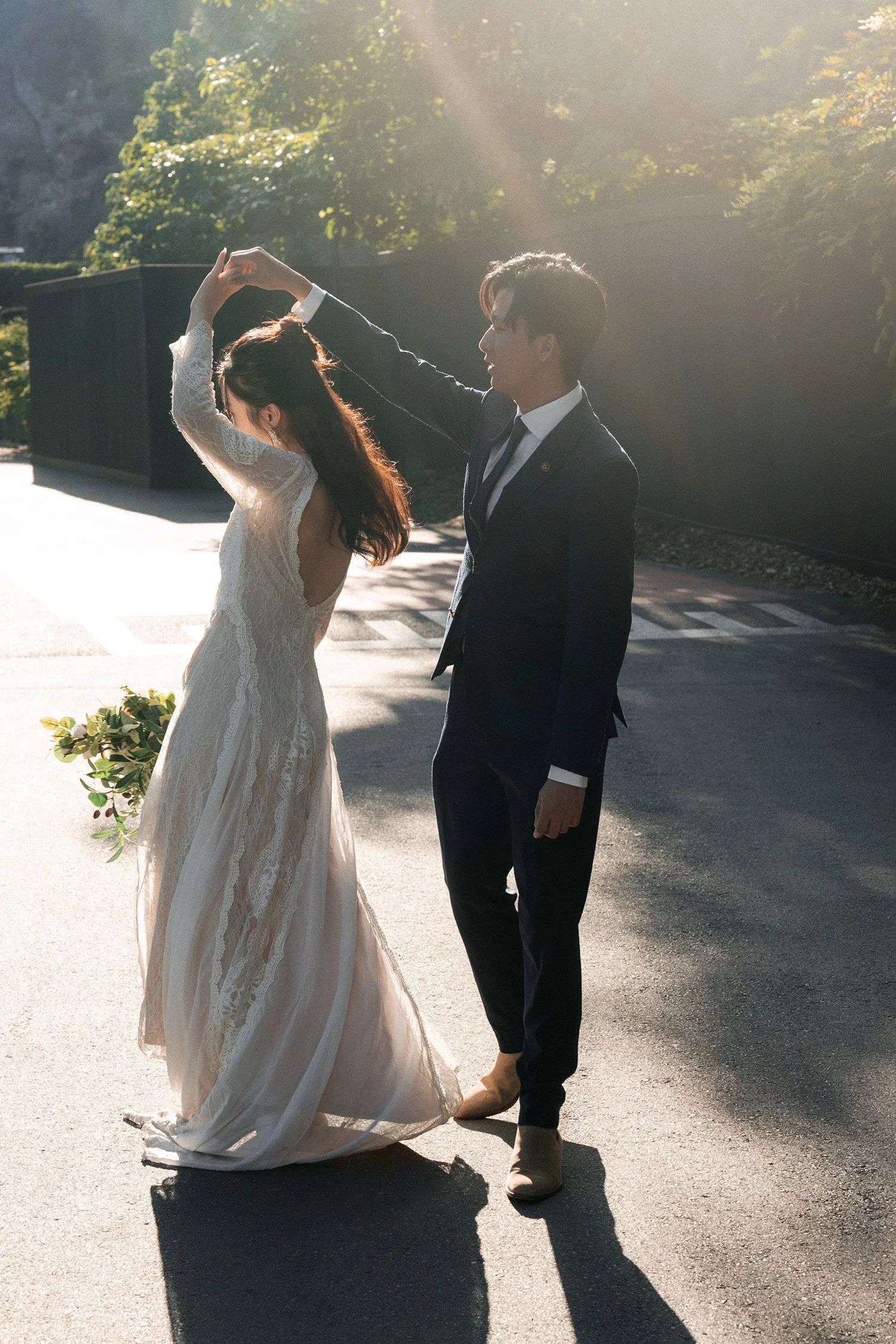 groom Leo making bride Cassie a spinning