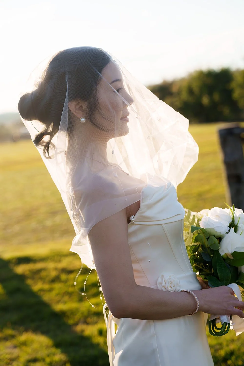 veil covering Flora's head