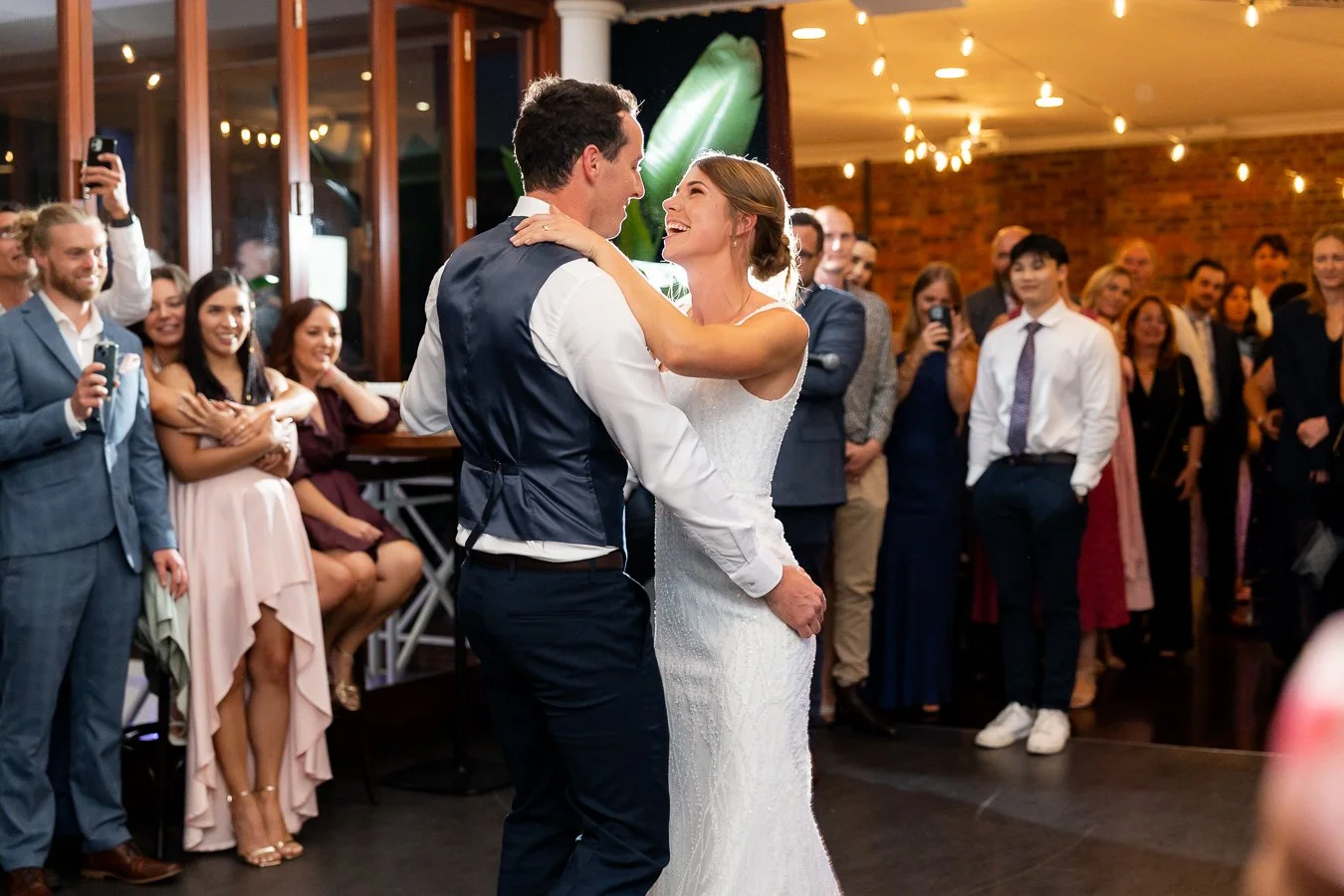 bride Sonya and groom Giordan holding each other in their first dance