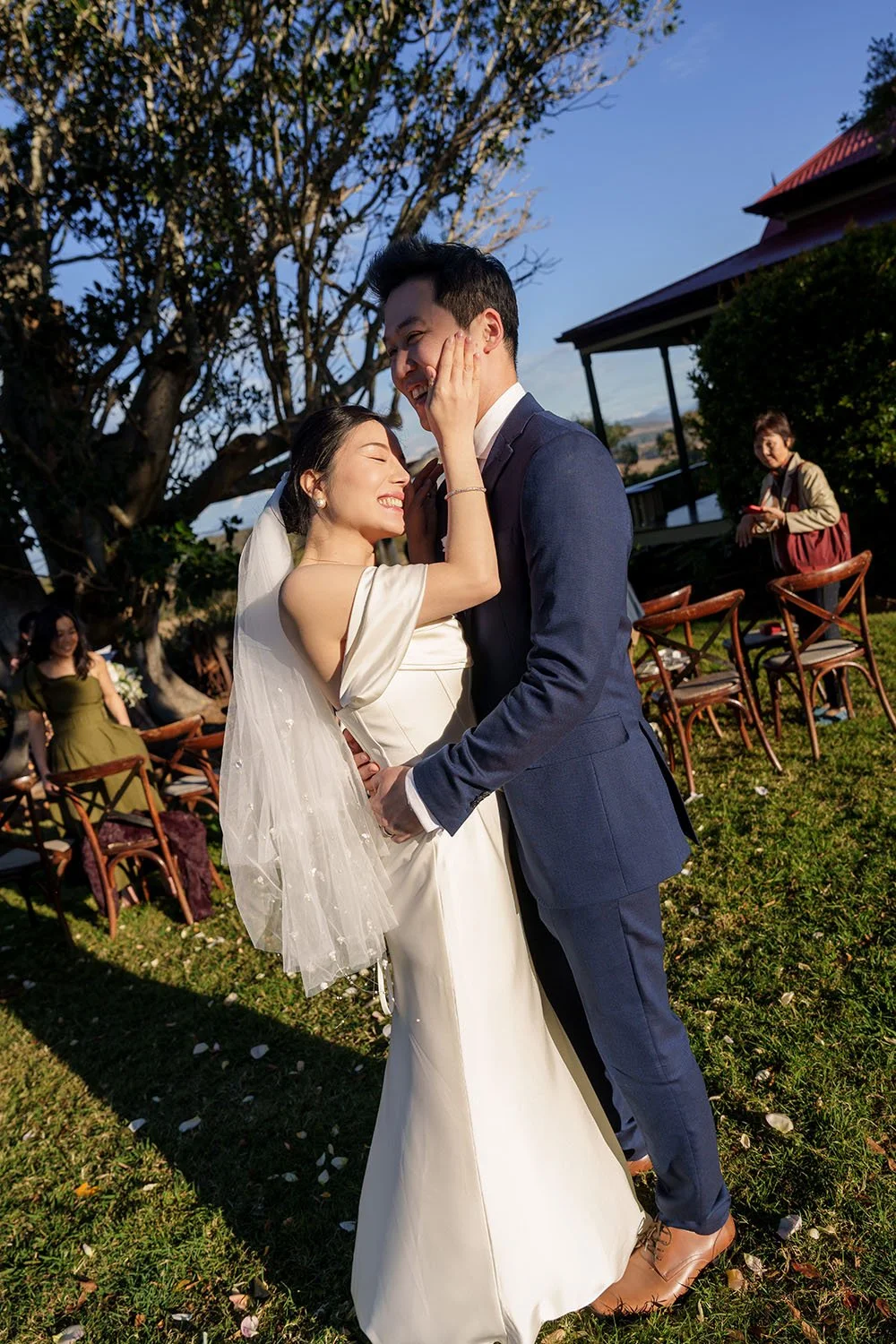 bride Flora touching Eric's face while he holding her