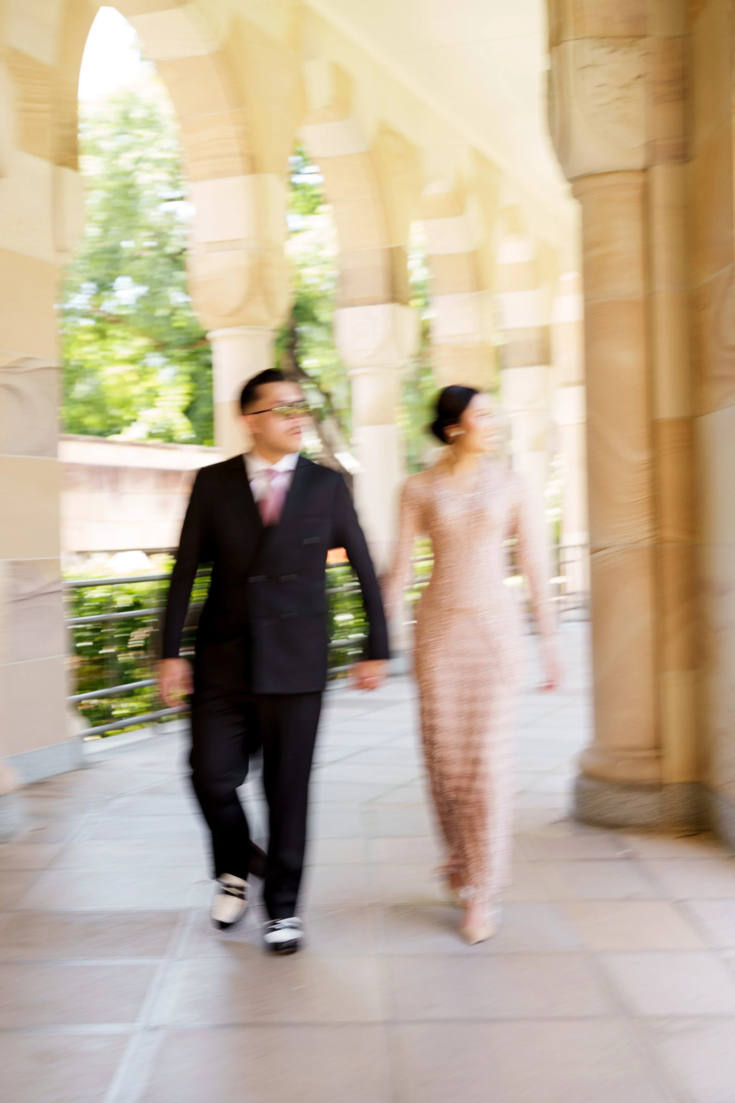 hands walking together look at outside the Great Hall with motion blur