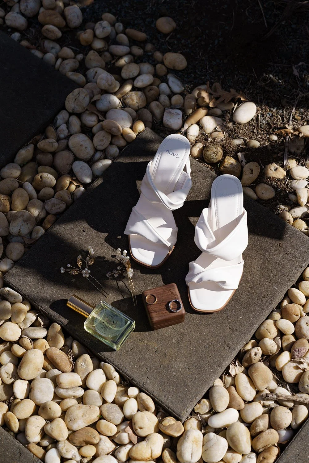 Jasmin's shoes wedding rings and perfume on the floor
