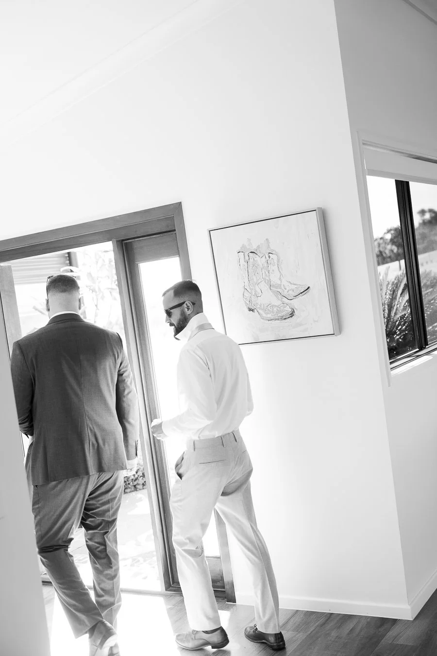 Ben and his brother walking out of the door