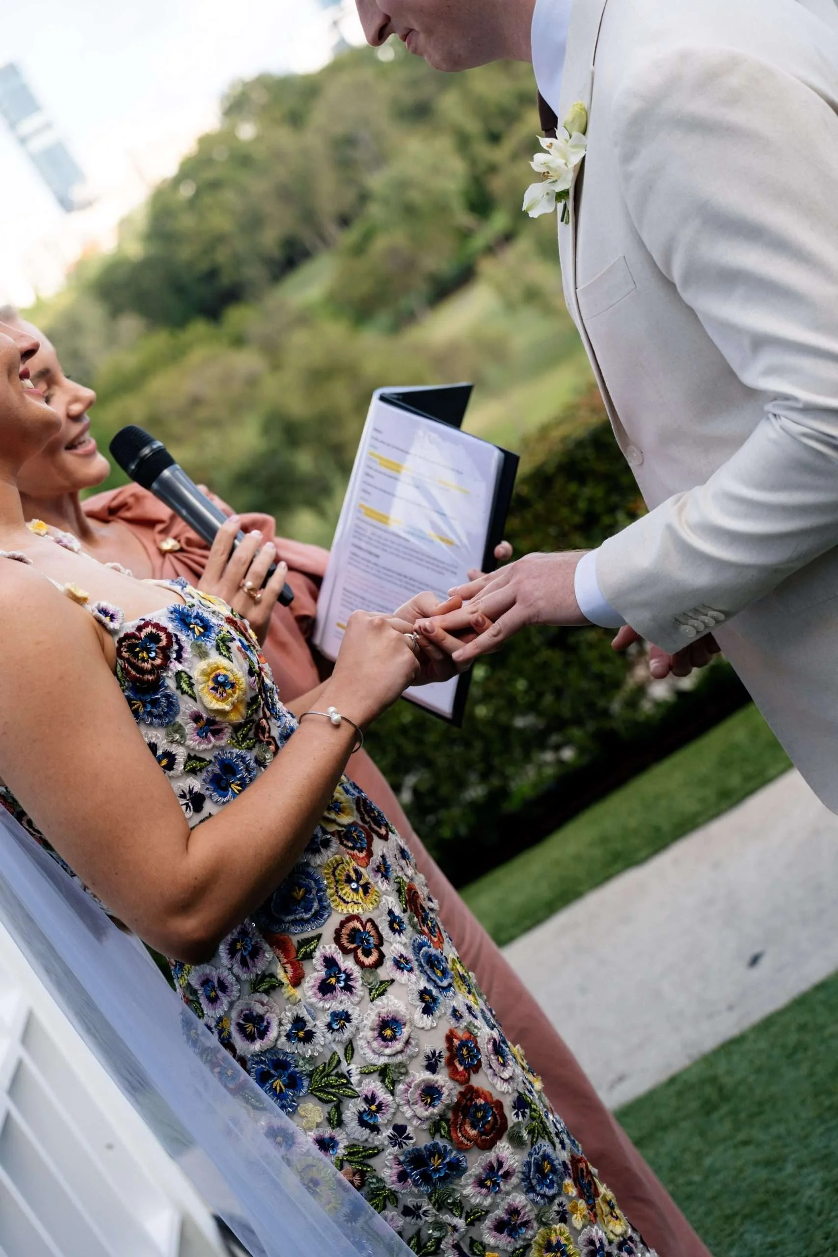 bride Charlotte put on the wedding ring for groom Jack