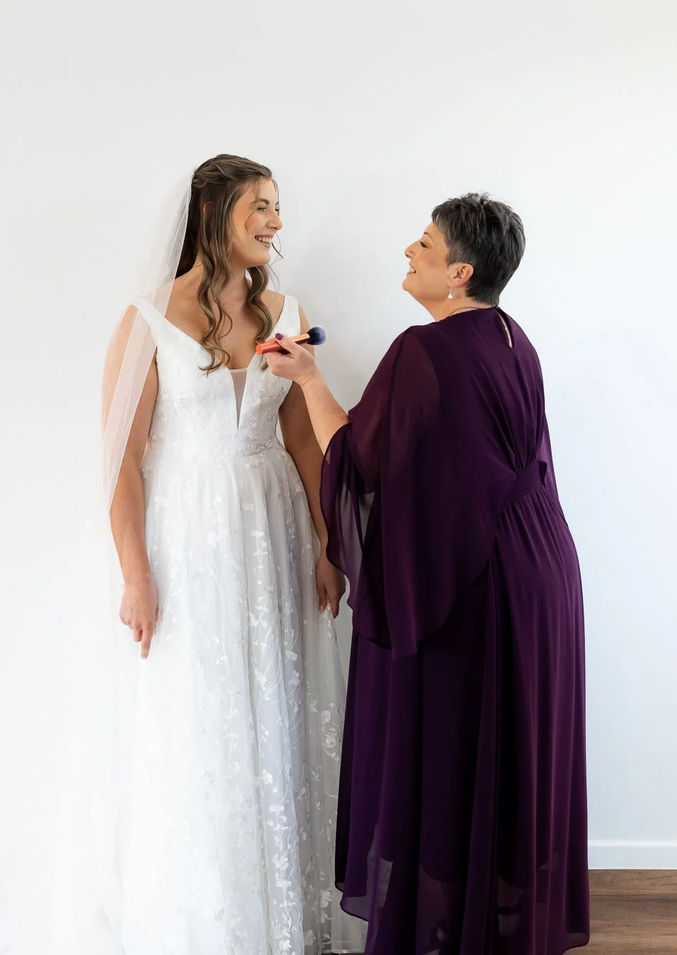 bride Chiarra and her mum look at each other