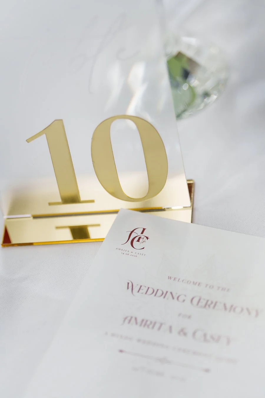 number card and paper invitation card on table