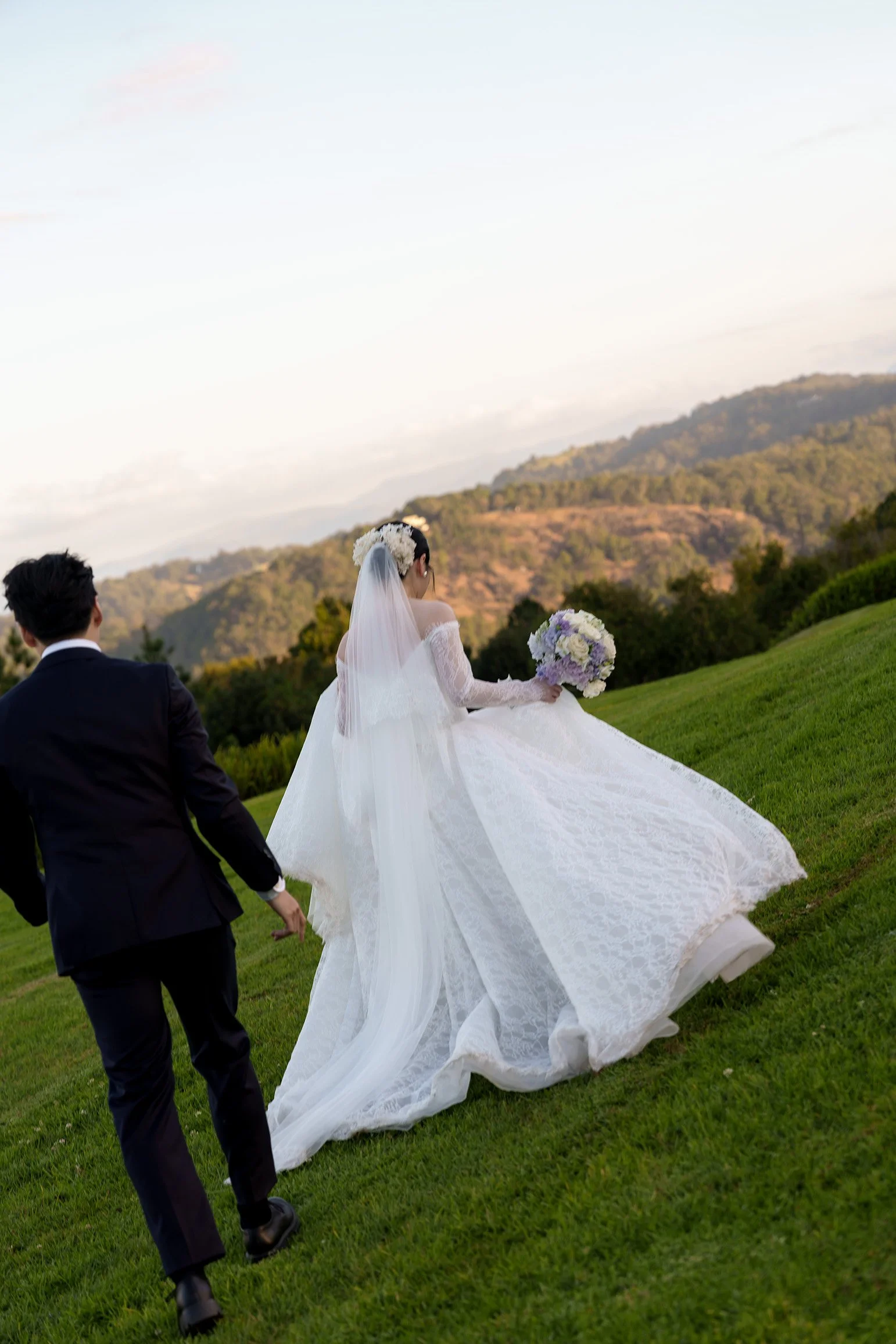 Lisa and Michael running away on the grass in Summergrove