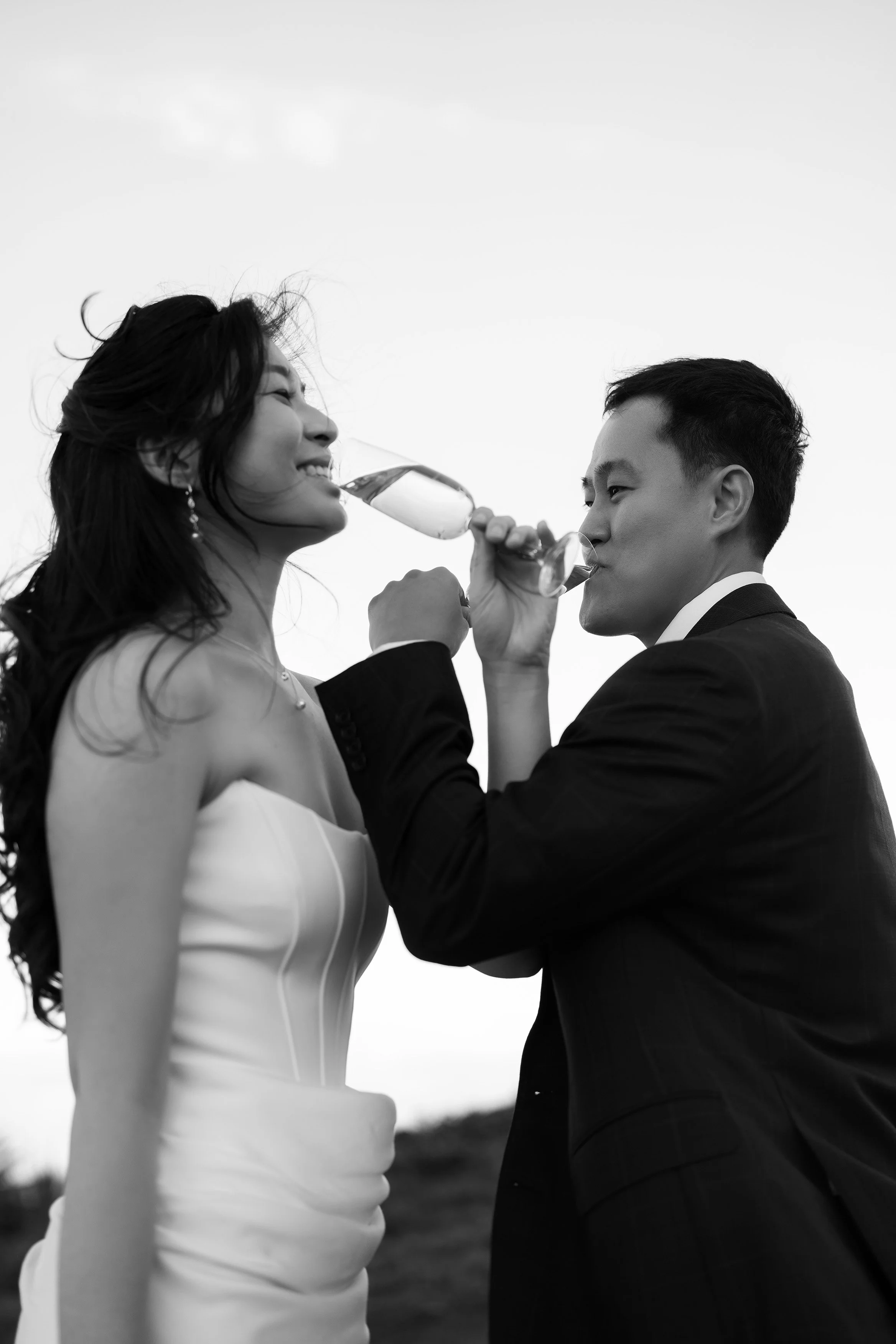 Margaret and Silva cross arm drinking Champaign