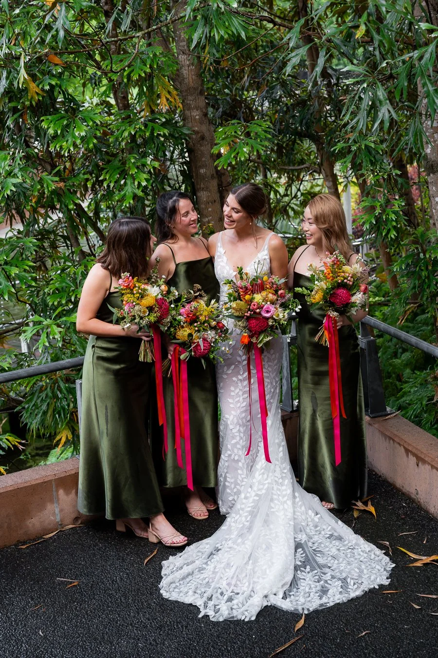 bride Sonya talk to her bridesmates with laughing