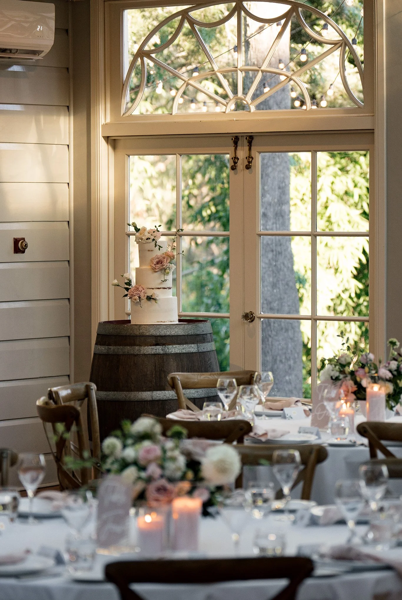 wedding cake on top of a beer barrel in reception room in Gabbinbar Homestead