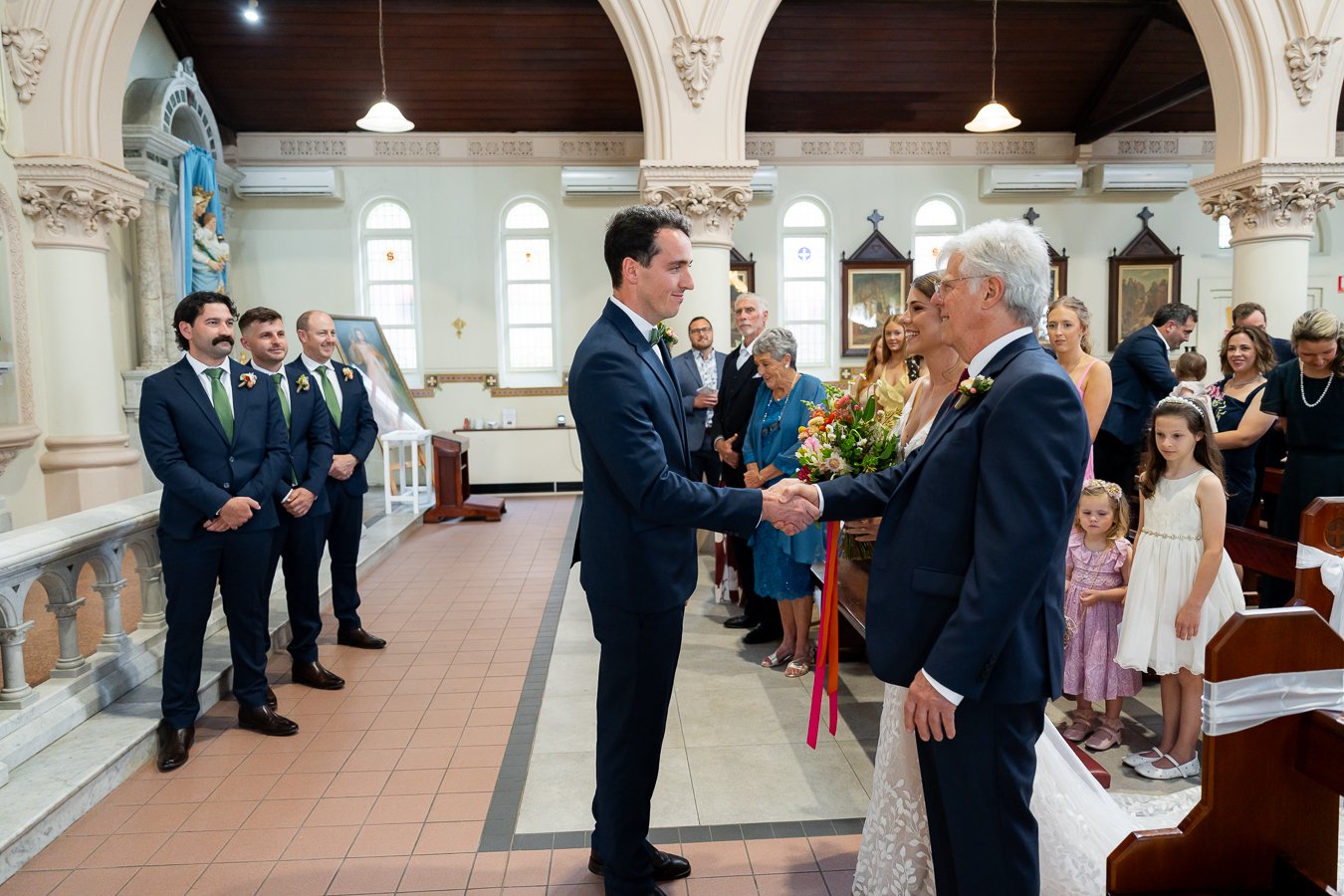 The bride’s father shook hands with the groom