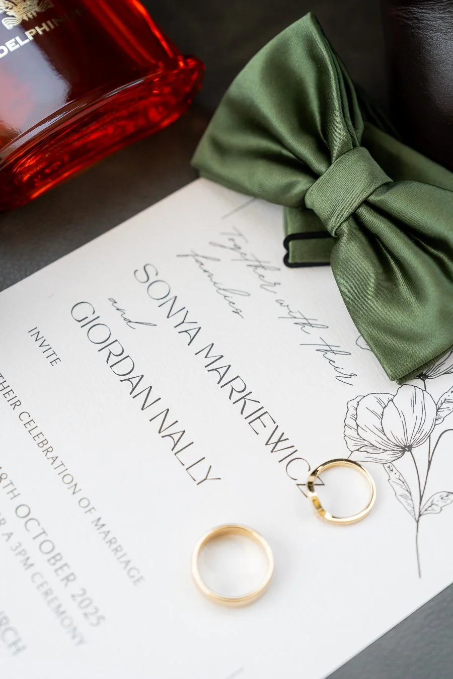 Their wedding rings were placed on top of the invitation card.