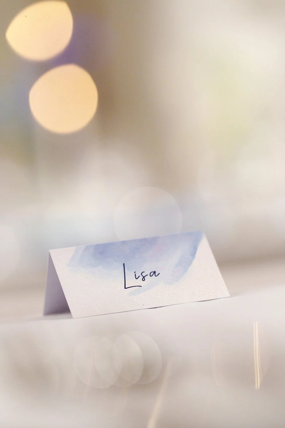 Lisa's name tag, with fair light background