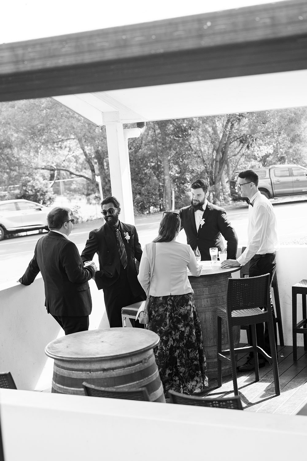Jay talking to his mates by surrounding a wine barrel