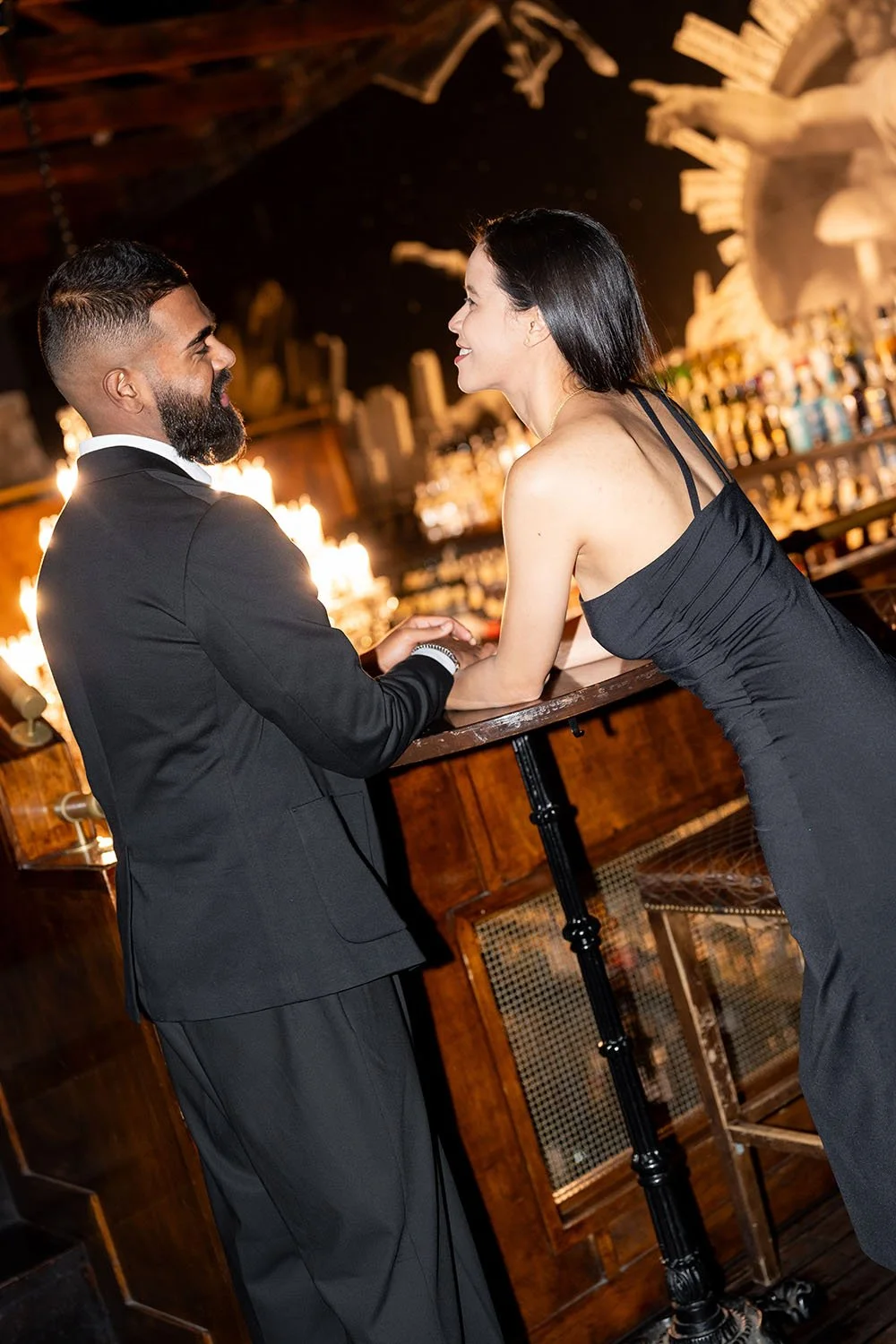 Jasmin and Jay holding hands talking