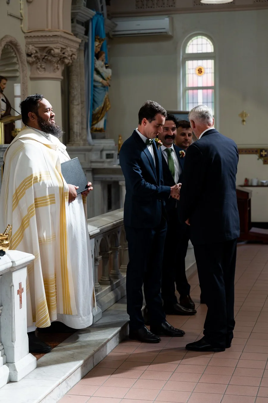 The groom’s father shook hands with the groom